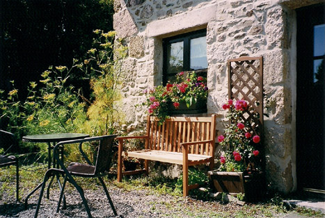 Exterior of The Little Barn with seating